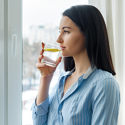 Woman drinking reverse osmosis water